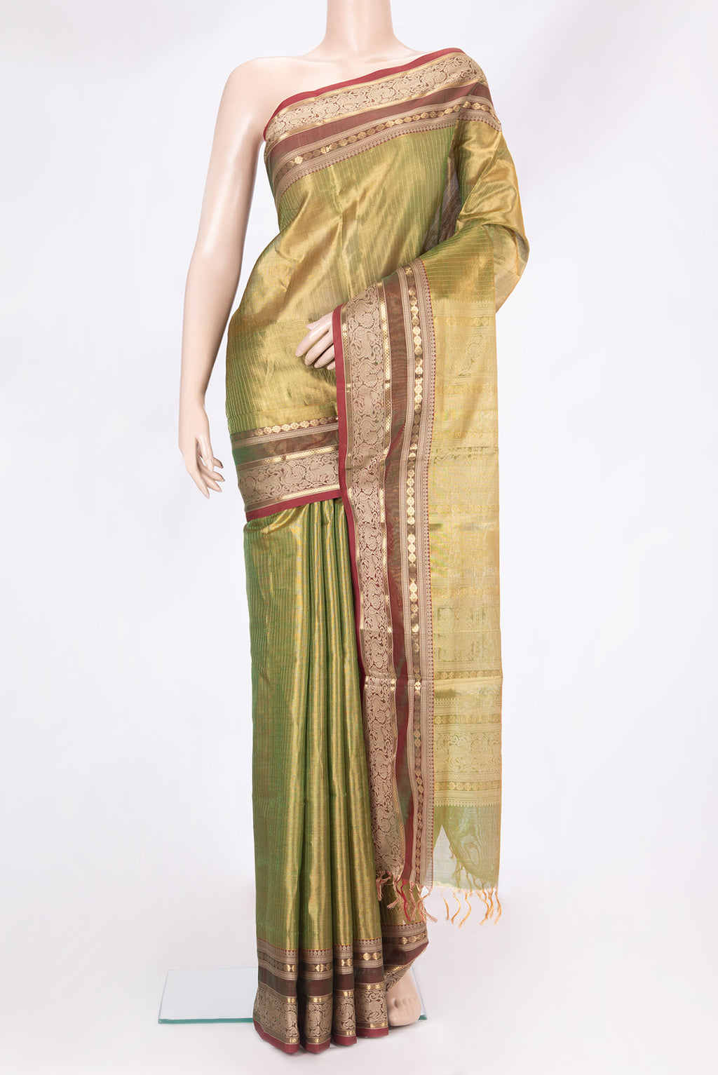 Green Dual Tone Silk Cotton Saree with Stripes on the body and Zari And Thread Border.  displayed on a mannequin