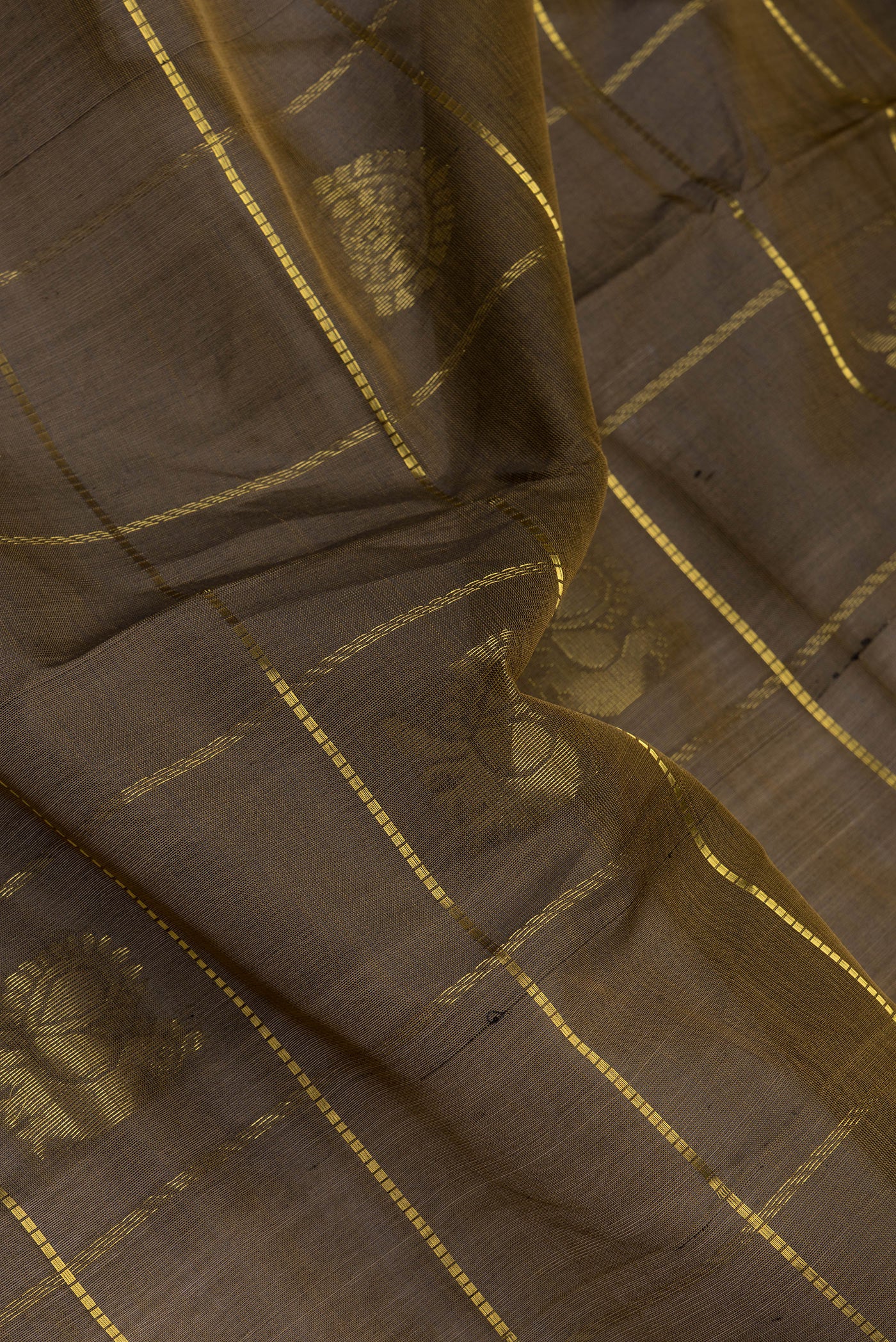 Close up of Mehandi Green Dual Tone Silk Cotton Saree with Checked design on the body and Zari Border.  displaying folds