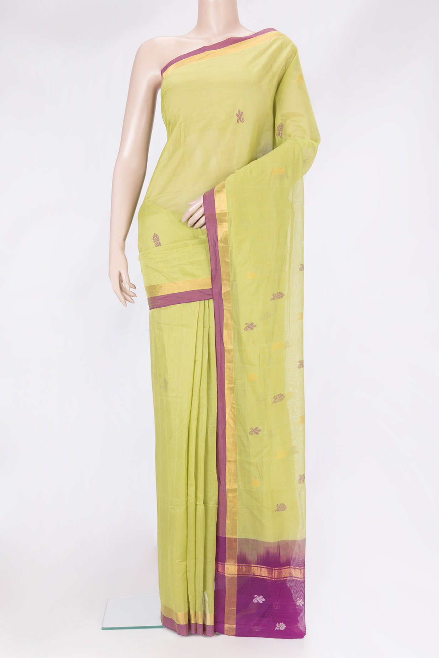 Pista Green Uppada Cotton Saree with Zari And Thread Butta on the body and Zari Border.  displayed on a mannequin