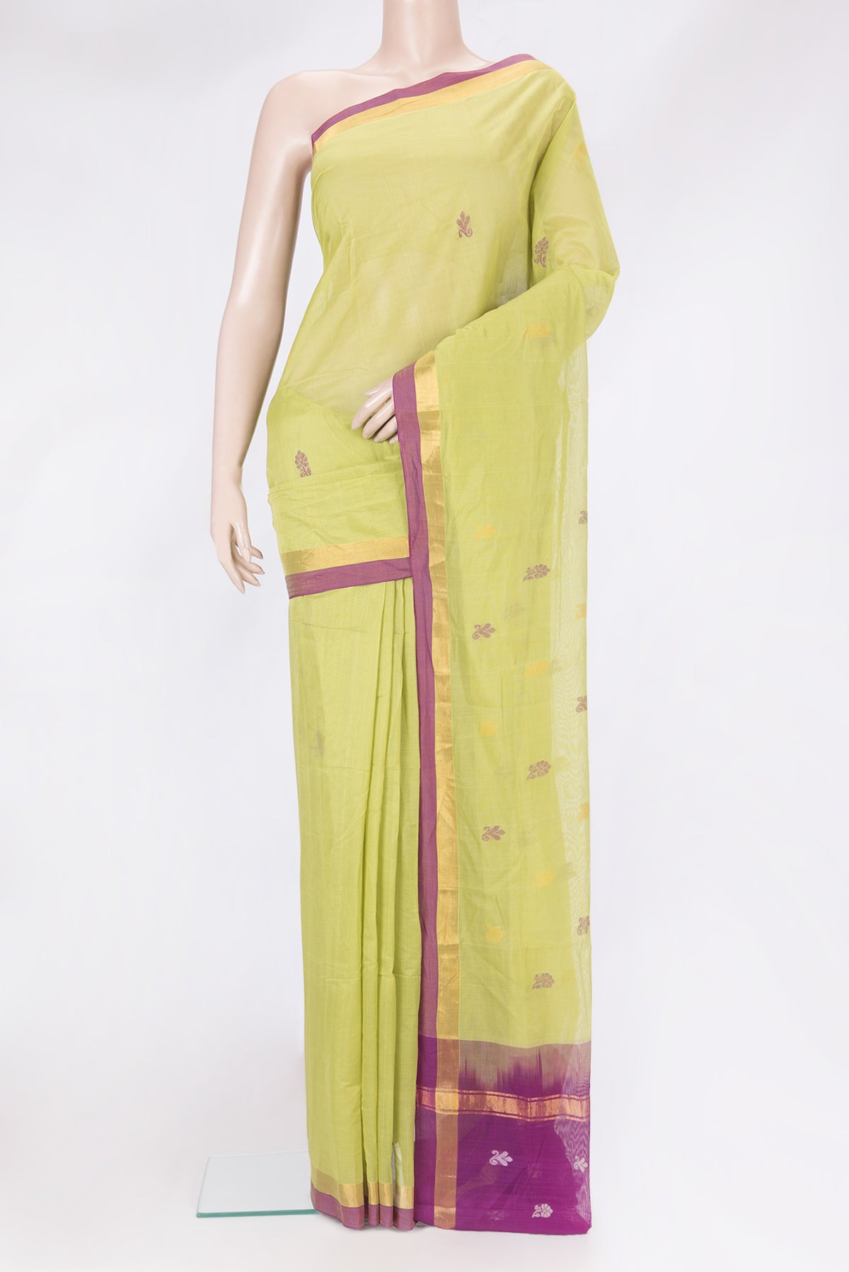 Pista Green Uppada Cotton Saree with Zari And Thread Butta on the body and Zari Border.  displayed on a mannequin