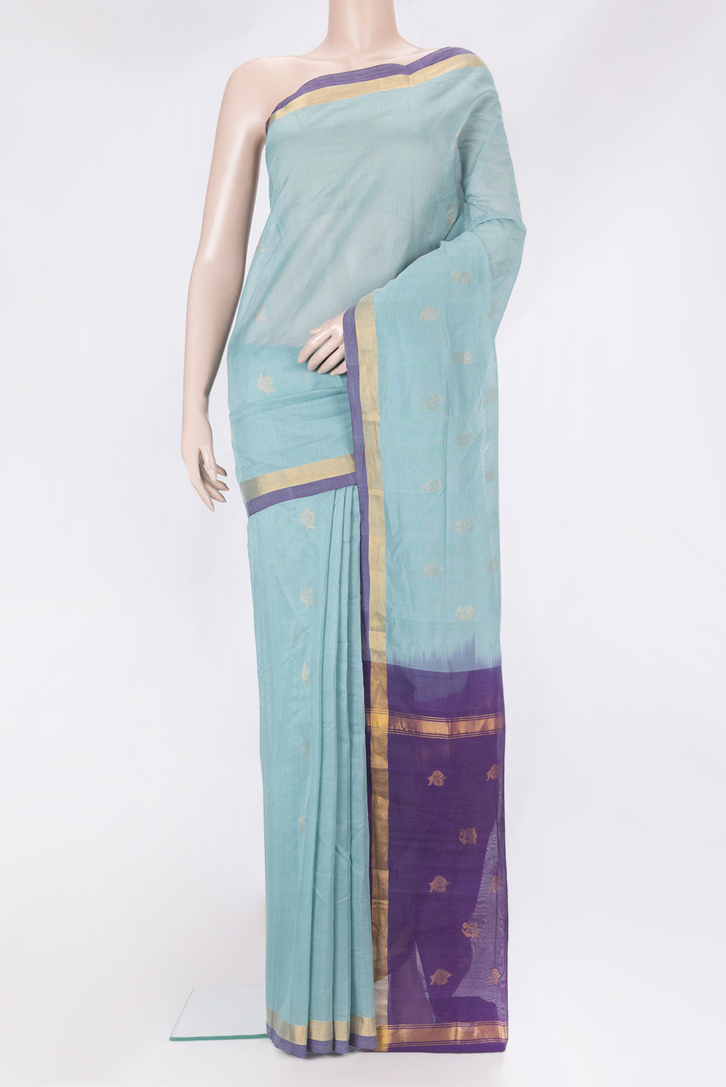 Light Blue Uppada Cotton Saree with Zari Butta on the body and Zari Border.  displayed on a mannequin