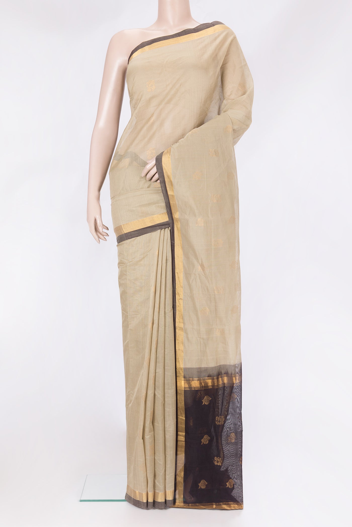 Beige Uppada Cotton Saree with Zari Butta on the body and Zari Border.  displayed on a mannequin