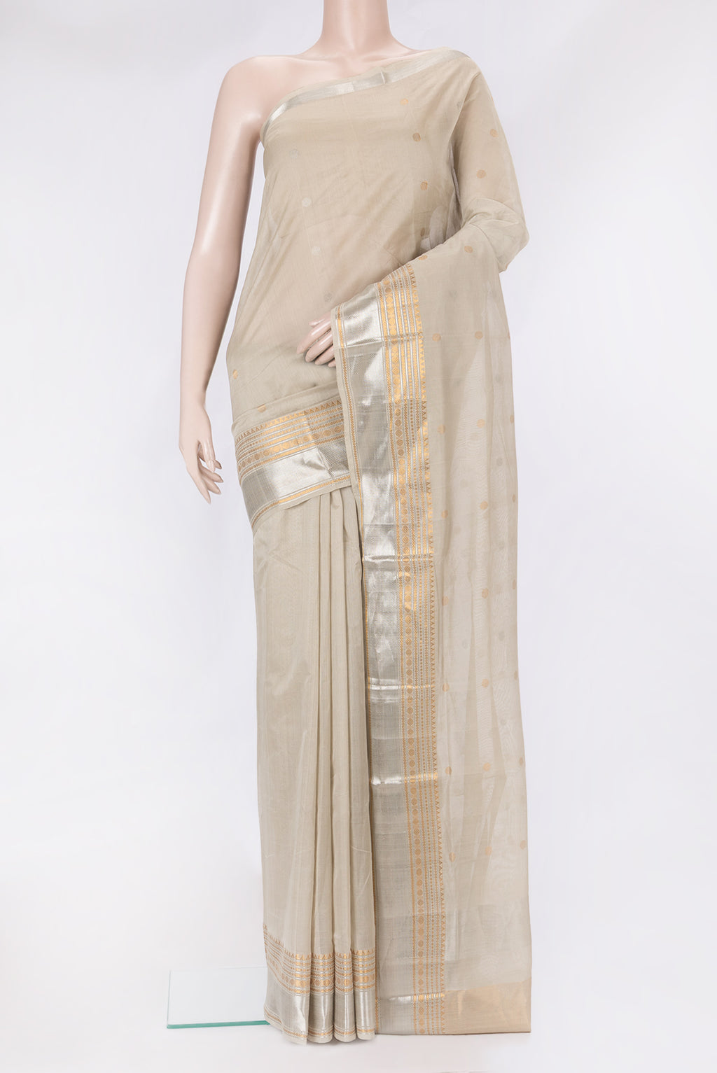 Beige Uppada Cotton Saree with Zari Butta on the body and Zari Border.  displayed on a mannequin