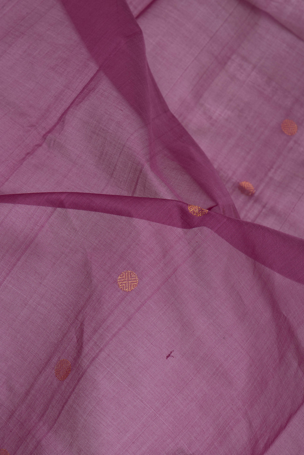 Close up of Purple Uppada Cotton Saree with Zari Butta on the body and Zari Border.  displaying folds