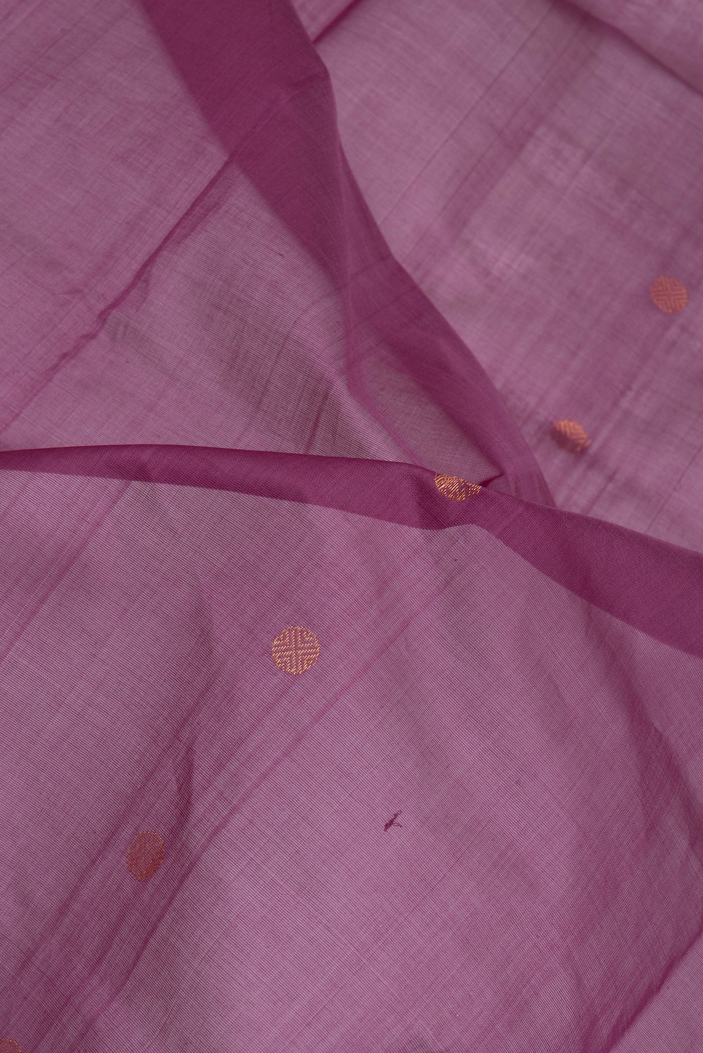 Close up of Purple Uppada Cotton Saree with Zari Butta on the body and Zari Border.  displaying folds
