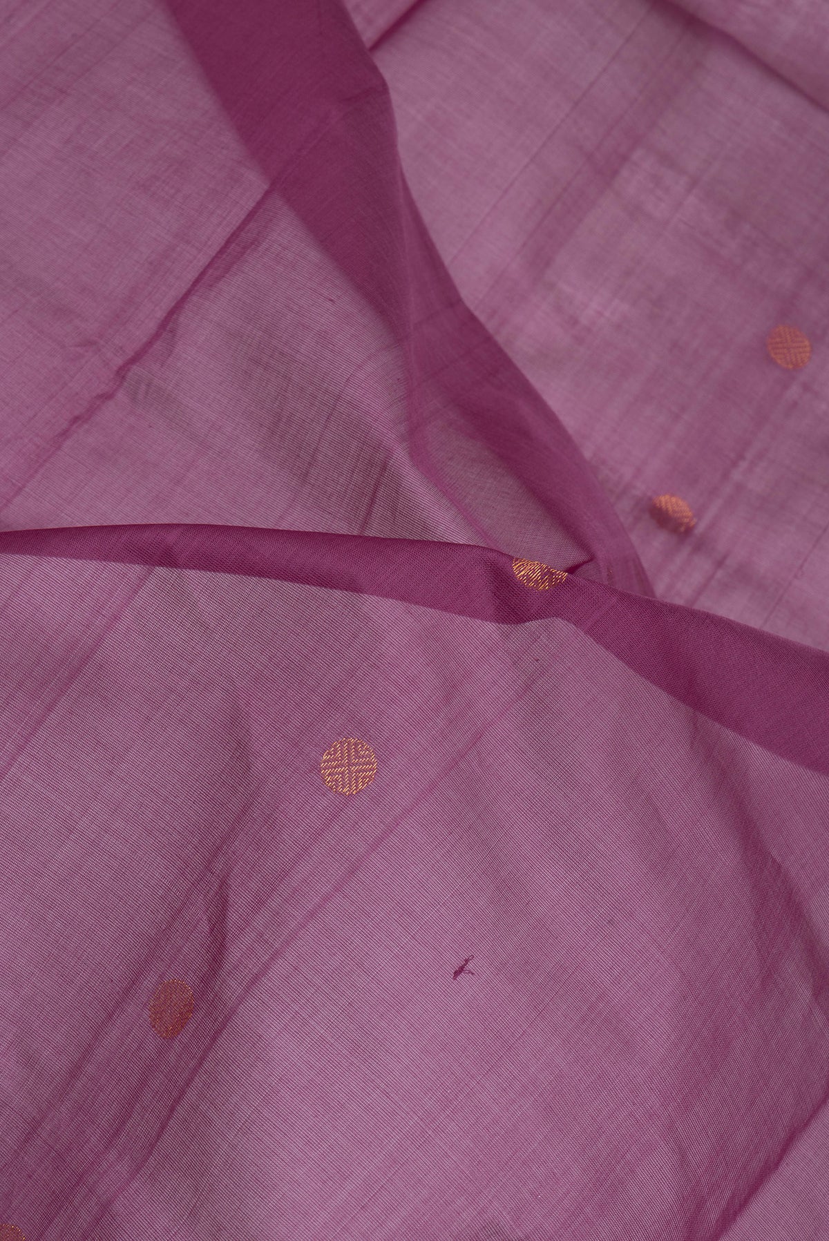 Close up of Purple Uppada Cotton Saree with Zari Butta on the body and Zari Border.  displaying folds