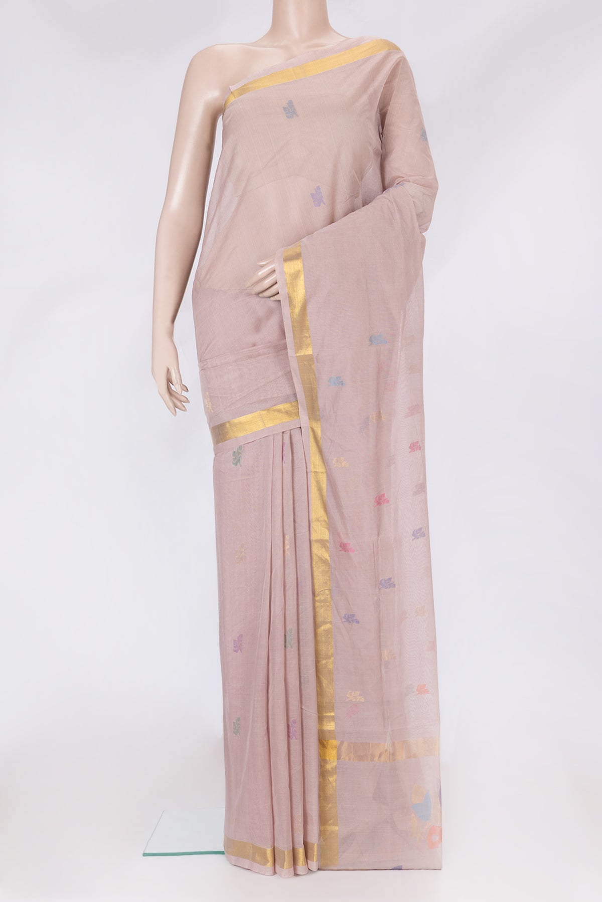 Rose Gold Uppada Cotton Saree with Zari And Thread Butta on the body and Zari Border.  displayed on a mannequin