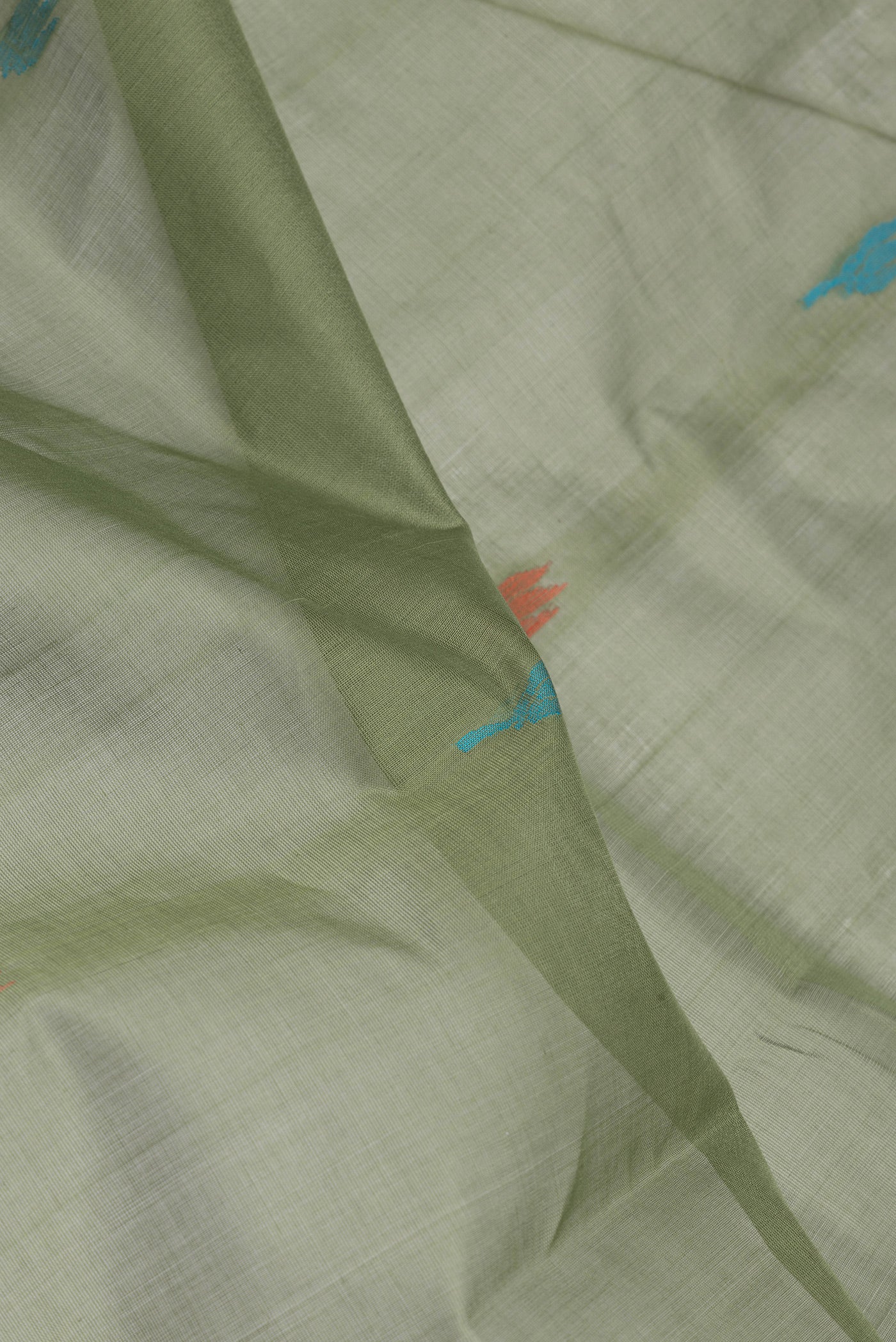 Close up of Mehandi Green Uppada Cotton Saree with Thread Butta on the body and Zari Border.  displaying folds