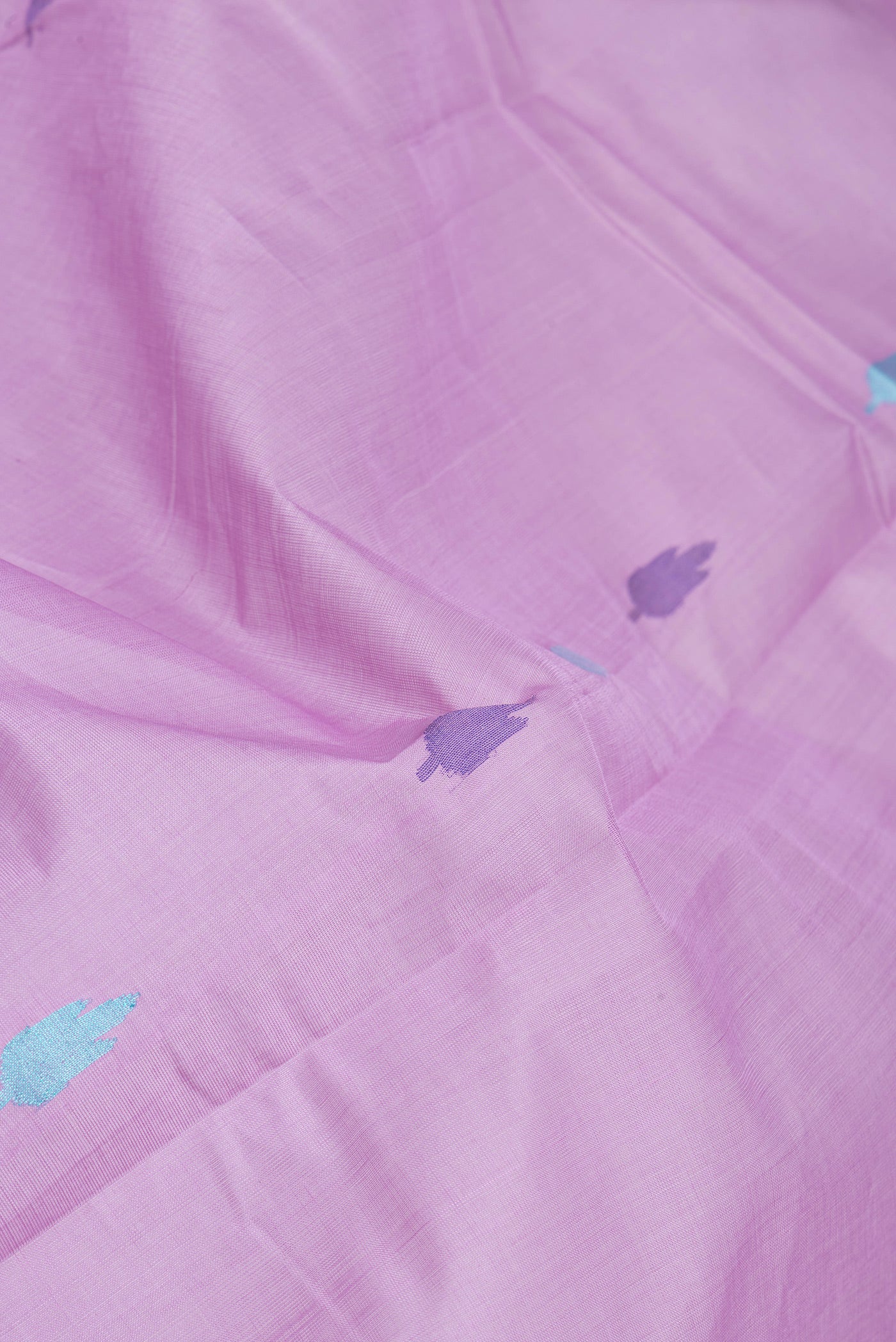 Close up of Lavender Uppada Cotton Saree with Thread Butta on the body and Zari Border.  displaying folds
