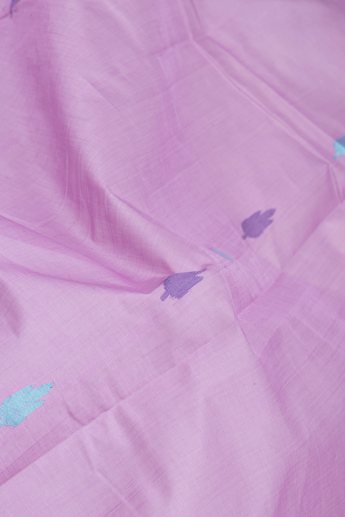 Close up of Lavender Uppada Cotton Saree with Thread Butta on the body and Zari Border.  displaying folds