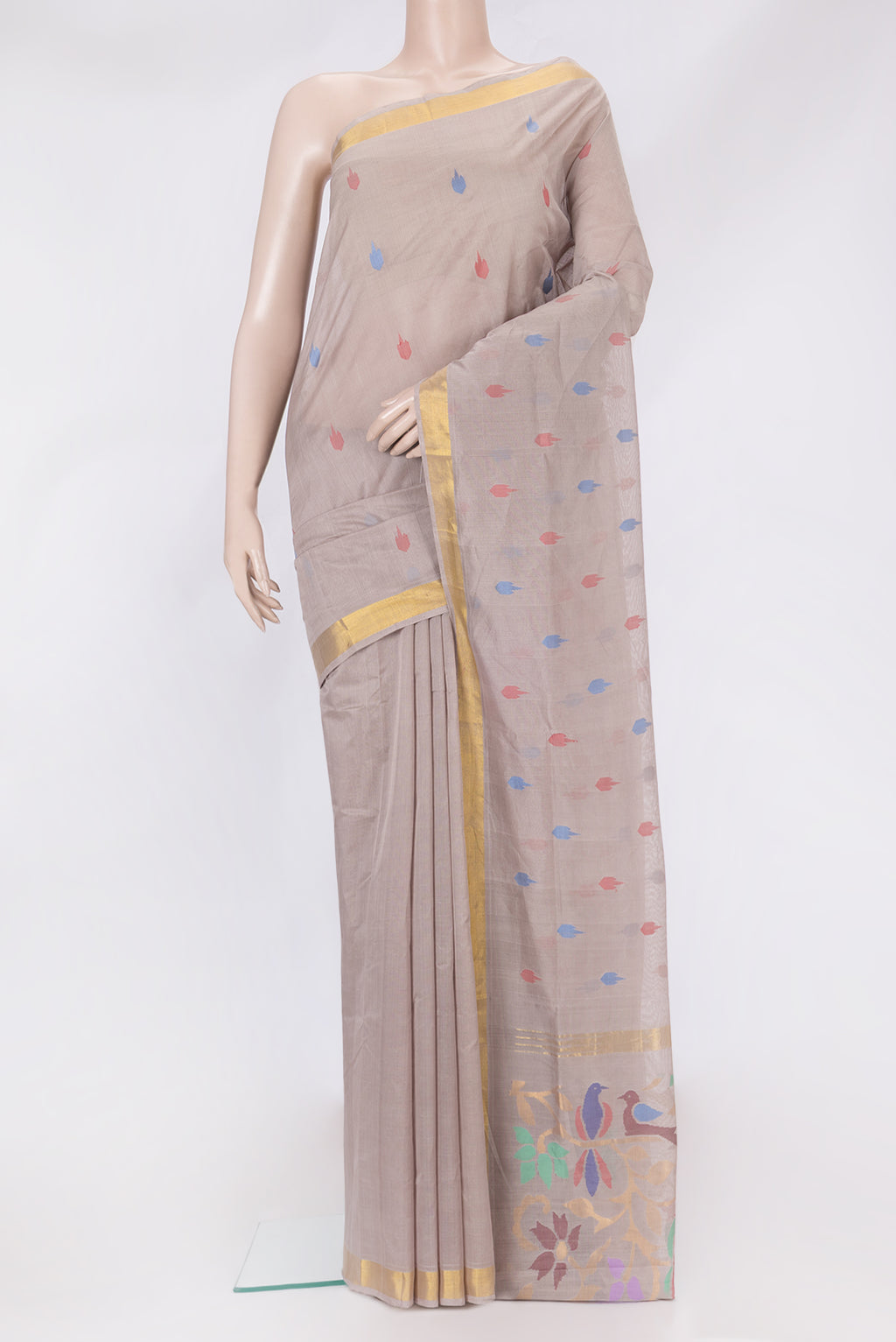 Beige Uppada Cotton Saree with Thread Butta on the body and Zari Border.  displayed on a mannequin