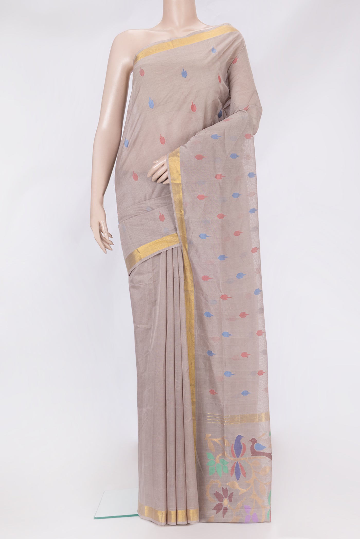 Beige Uppada Cotton Saree with Thread Butta on the body and Zari Border.  displayed on a mannequin