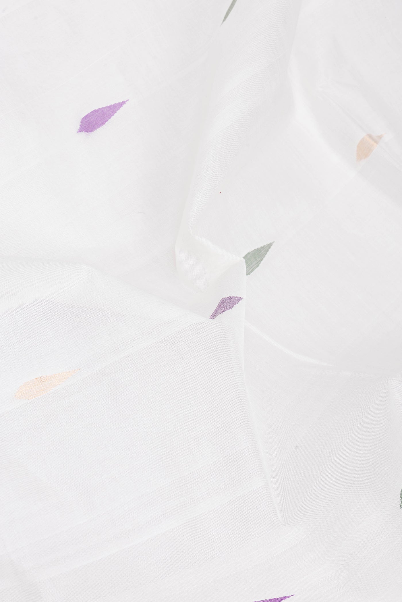 Close up of White Uppada Cotton Saree with Zari And Thread Butta on the body and Zari Border.  displaying folds
