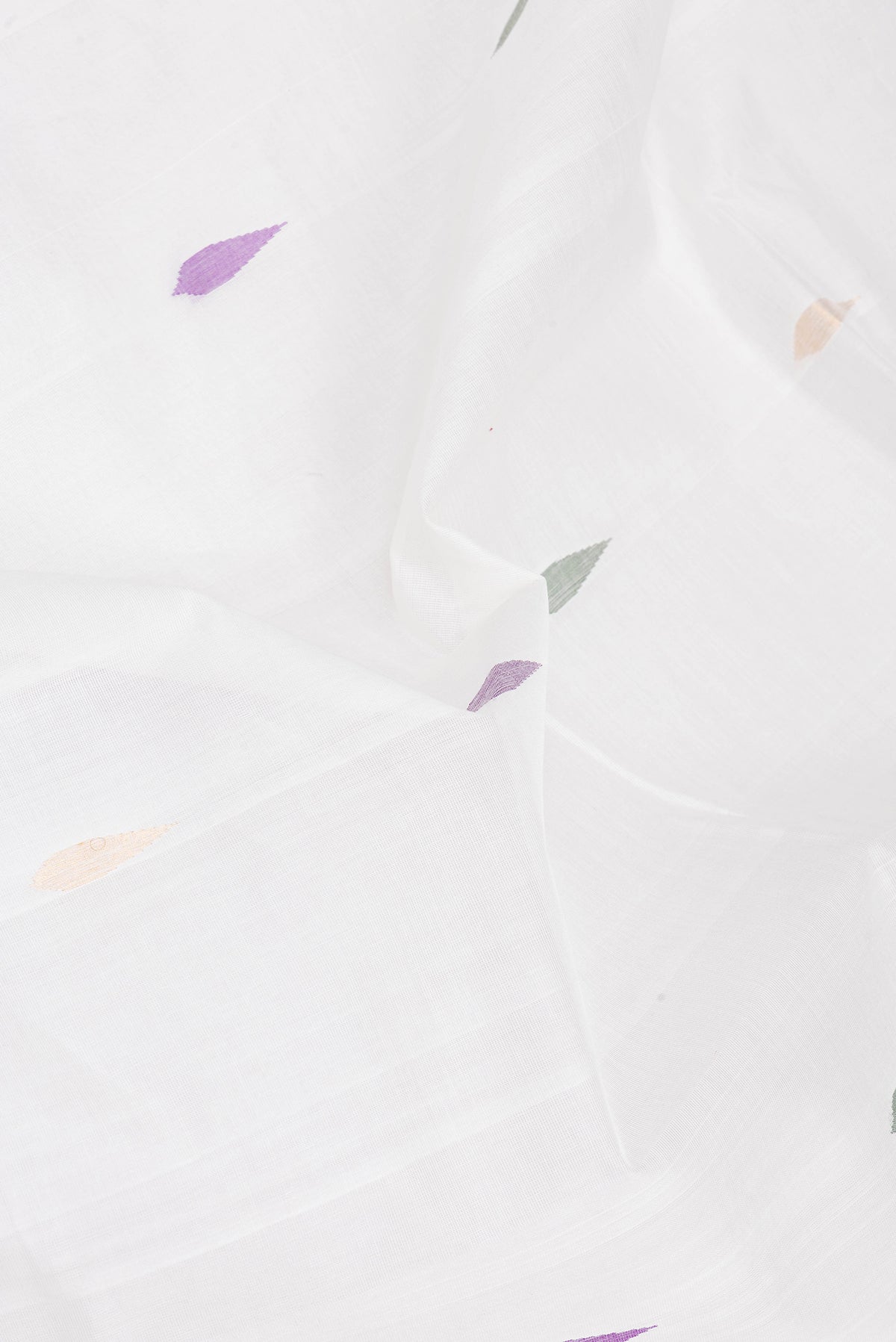 Close up of White Uppada Cotton Saree with Zari And Thread Butta on the body and Zari Border.  displaying folds