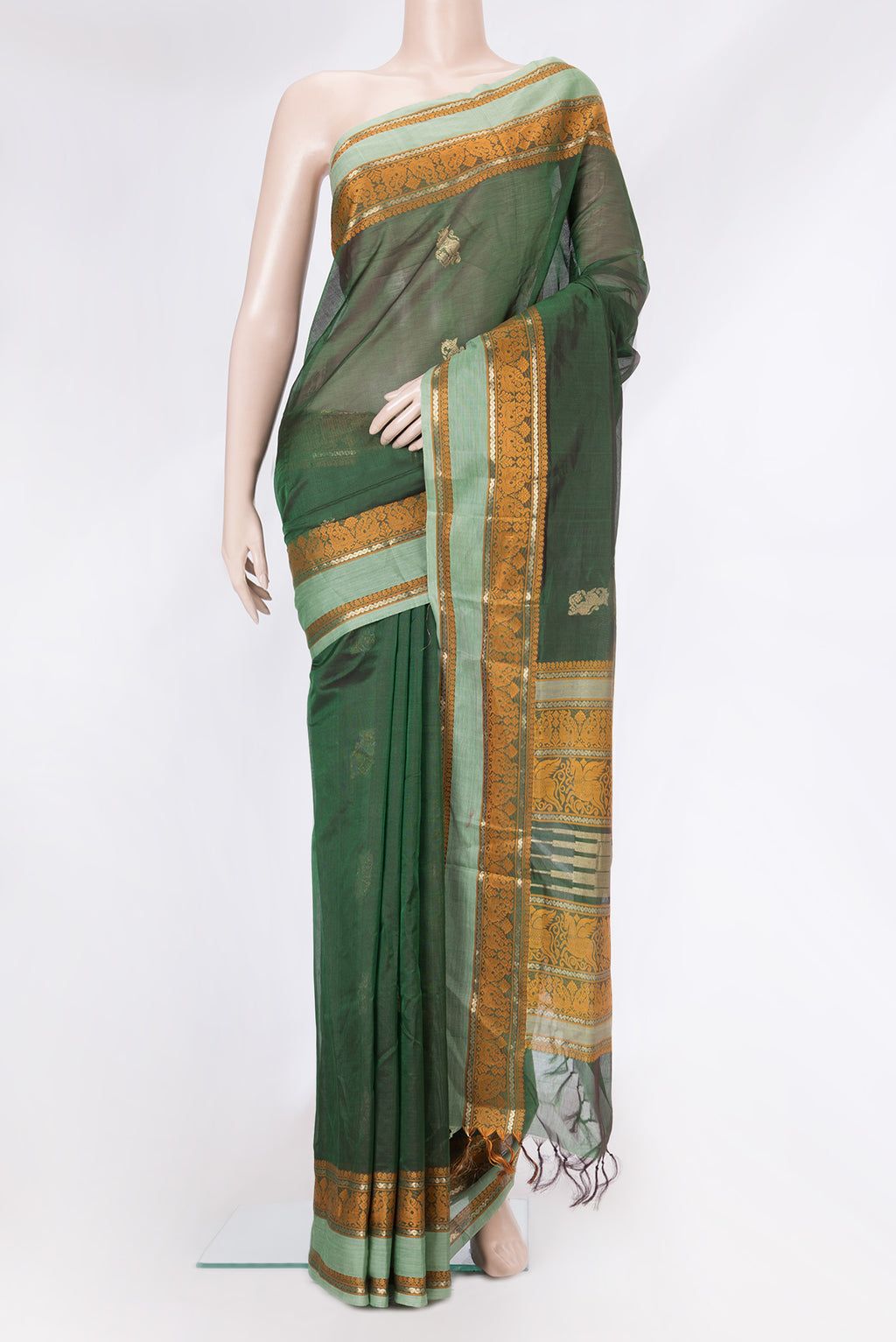 Bottle Green Dual Tone Silk Cotton Saree with Zari Butta on the body and Zari And Thread Border.  displayed on a mannequin
