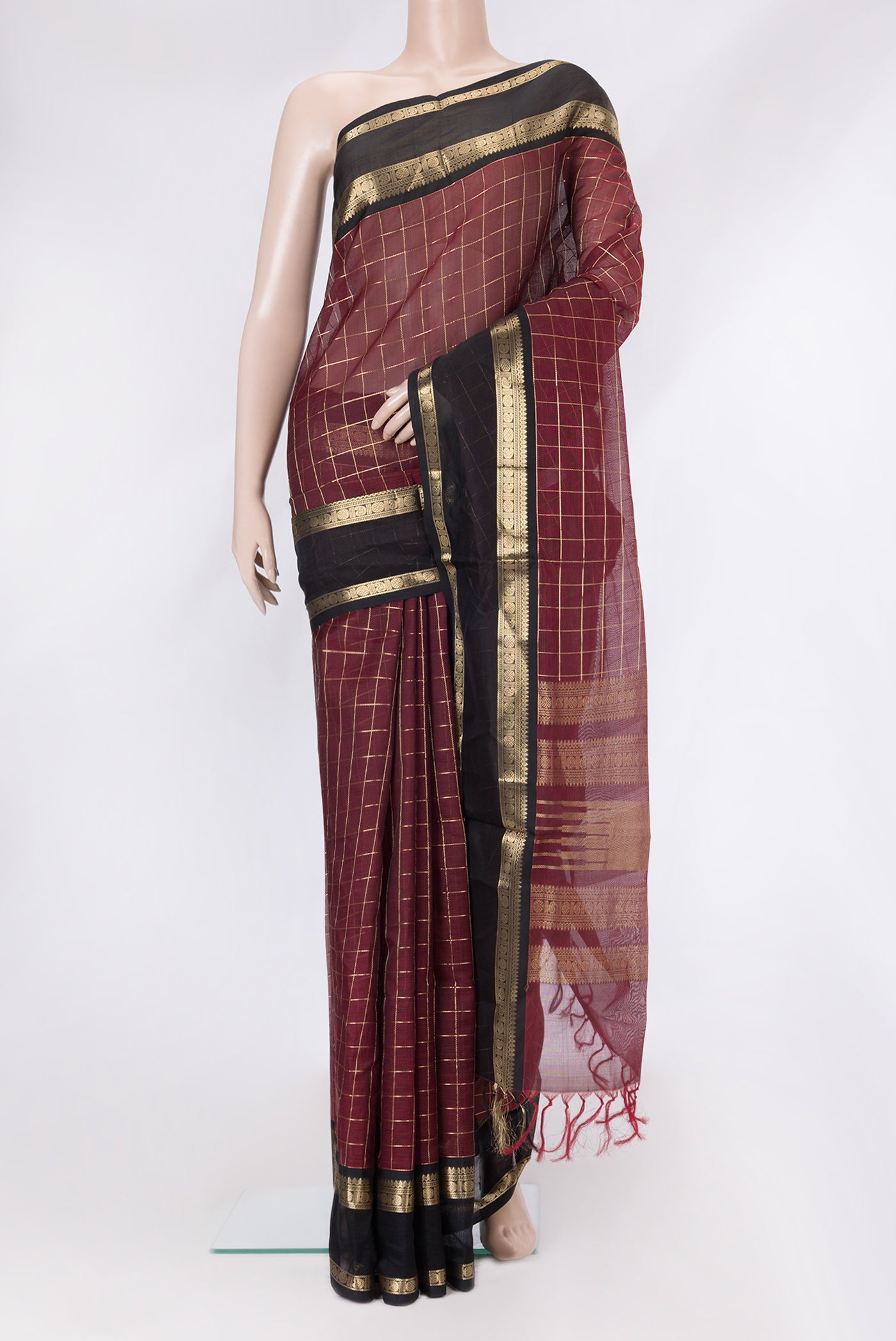 Maroon Dual Tone Silk Cotton Saree with Checked design on the body and Zari Border.  displayed on a mannequin
