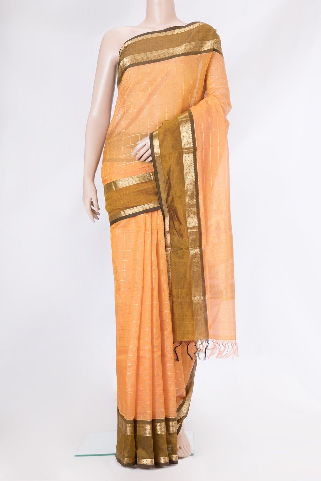Golden Peach Dual Tone Silk Cotton Saree with Checked design on the body and Zari Border.  displayed on a mannequin