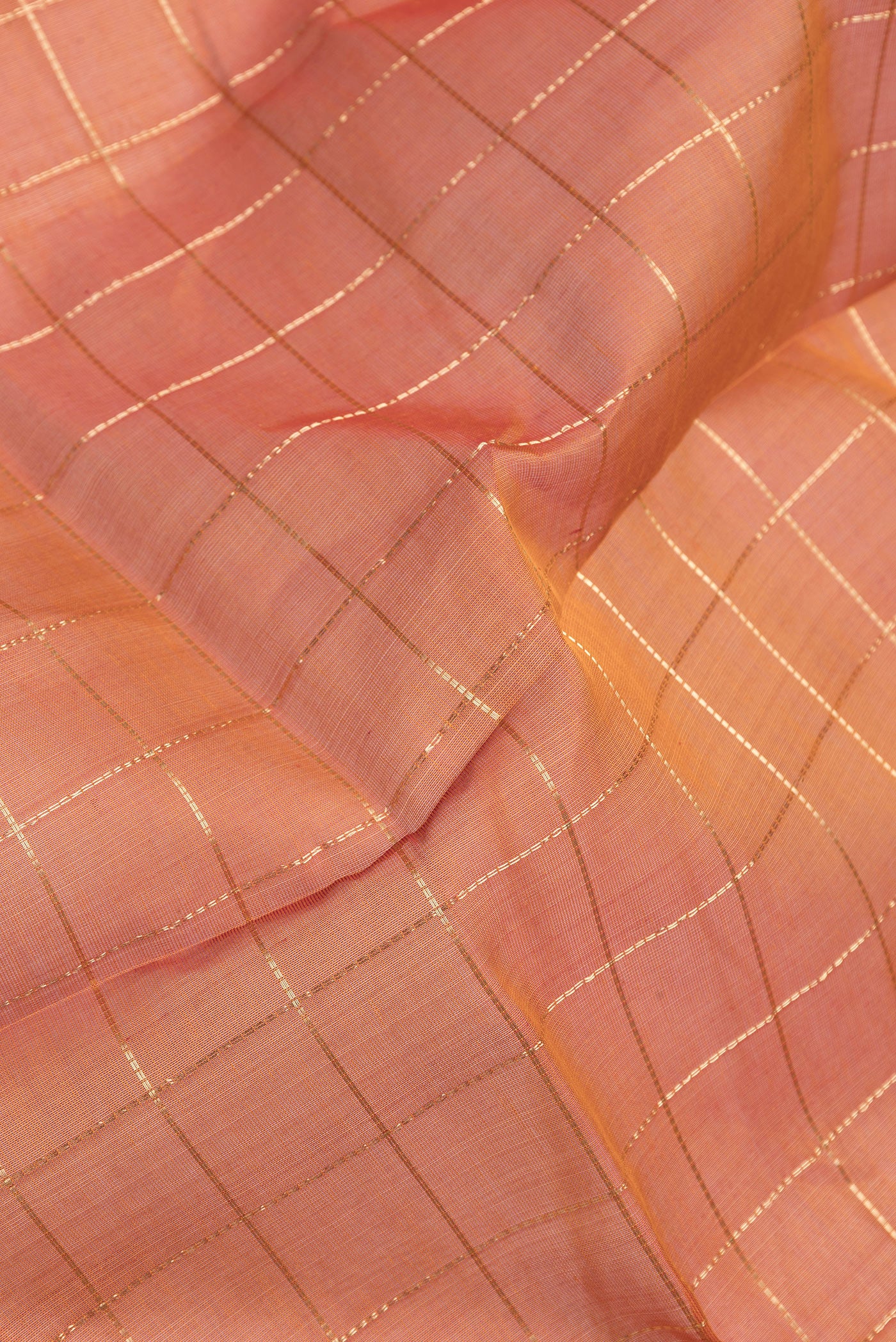 Close up of Mustard Dual Tone Silk Cotton Saree with Checked design on the body and Zari Border.  displaying folds
