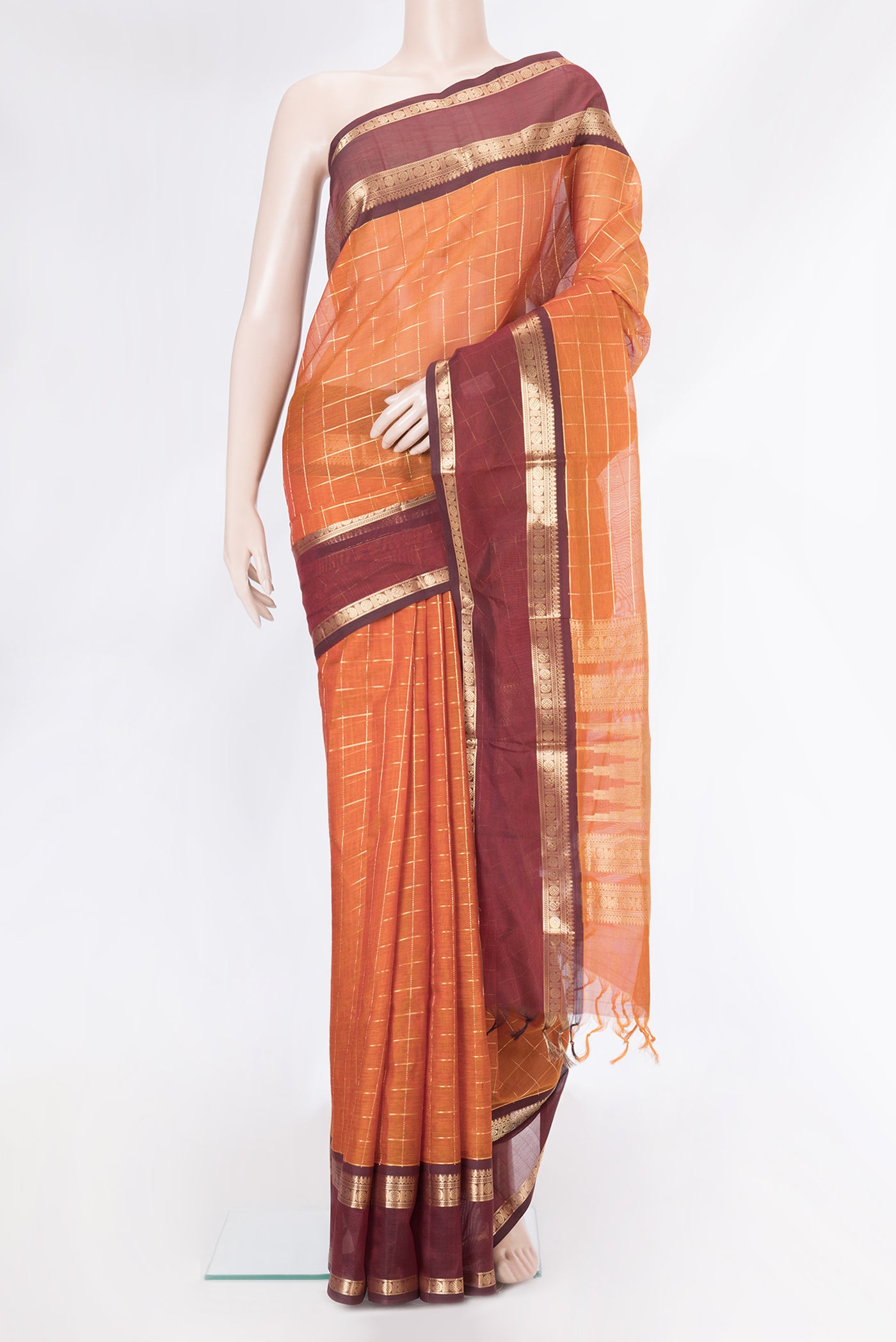 Mustard Dual Tone Silk Cotton Saree with Checked design on the body and Zari Border.  displayed on a mannequin