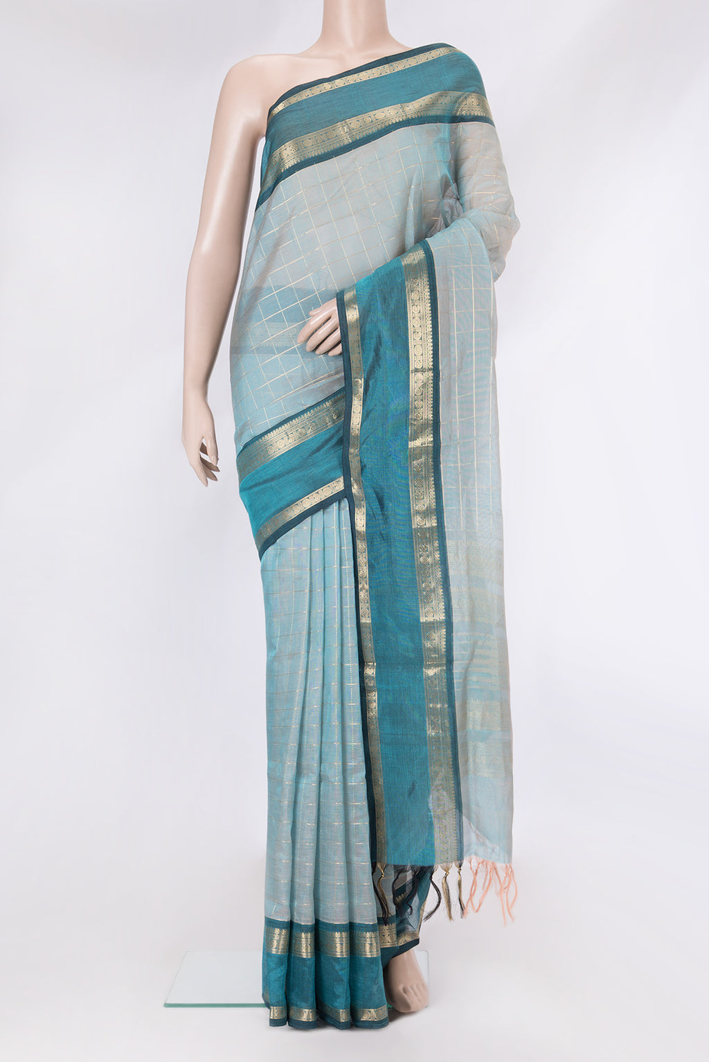 Sky Blue Dual Tone Silk Cotton Saree with Checked design on the body and Zari Border.  displayed on a mannequin