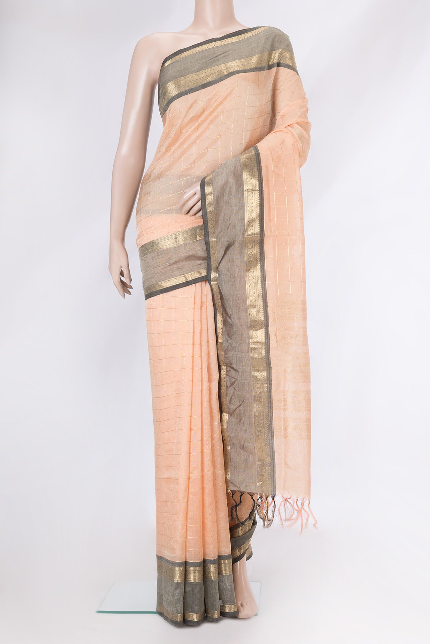 Golden Peach Dual Tone Silk Cotton Saree with Checked design on the body and Zari Border.  displayed on a mannequin