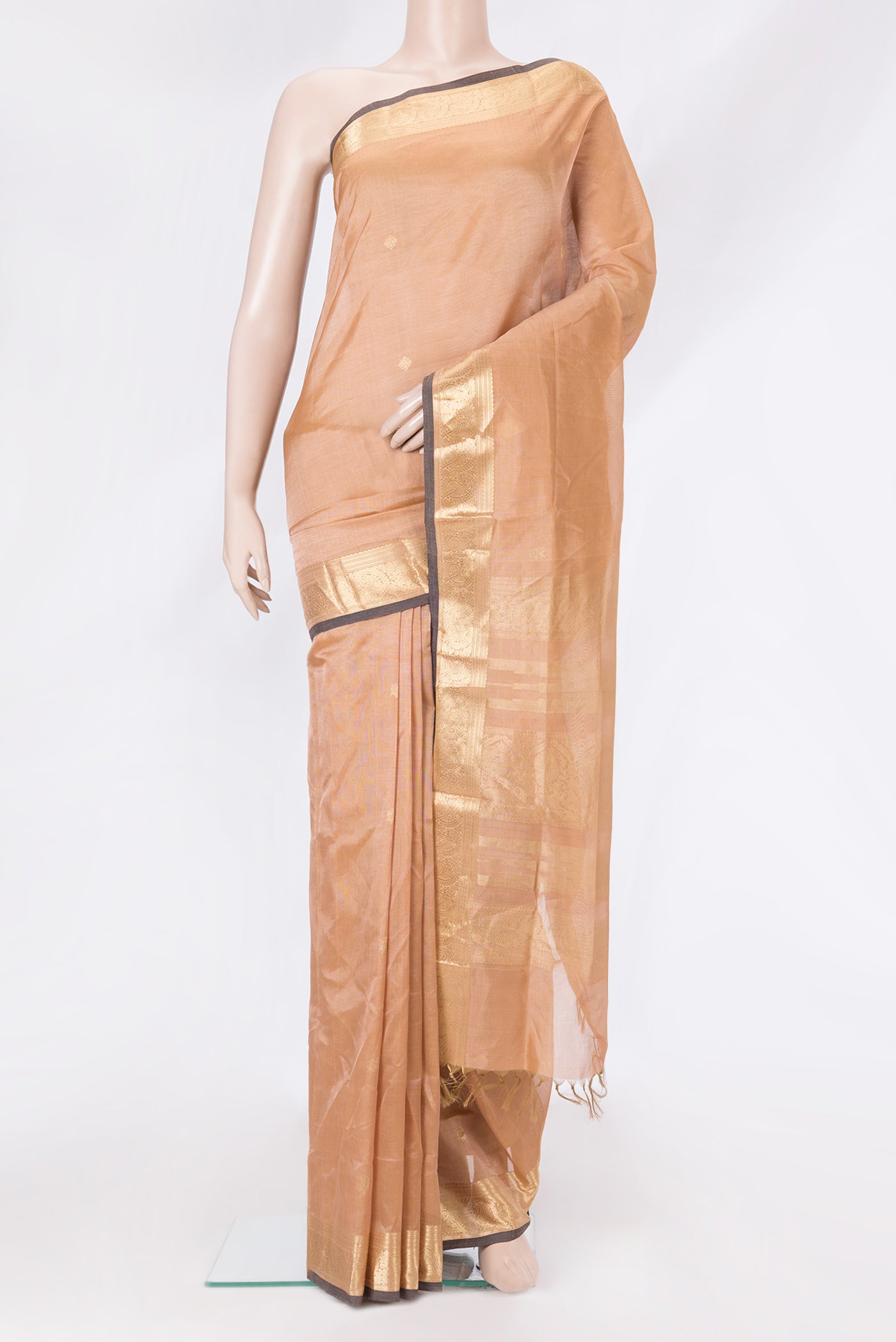 Peach Dual Tone Silk Cotton Saree with Zari Butta on the body and Zari Border.  displayed on a mannequin