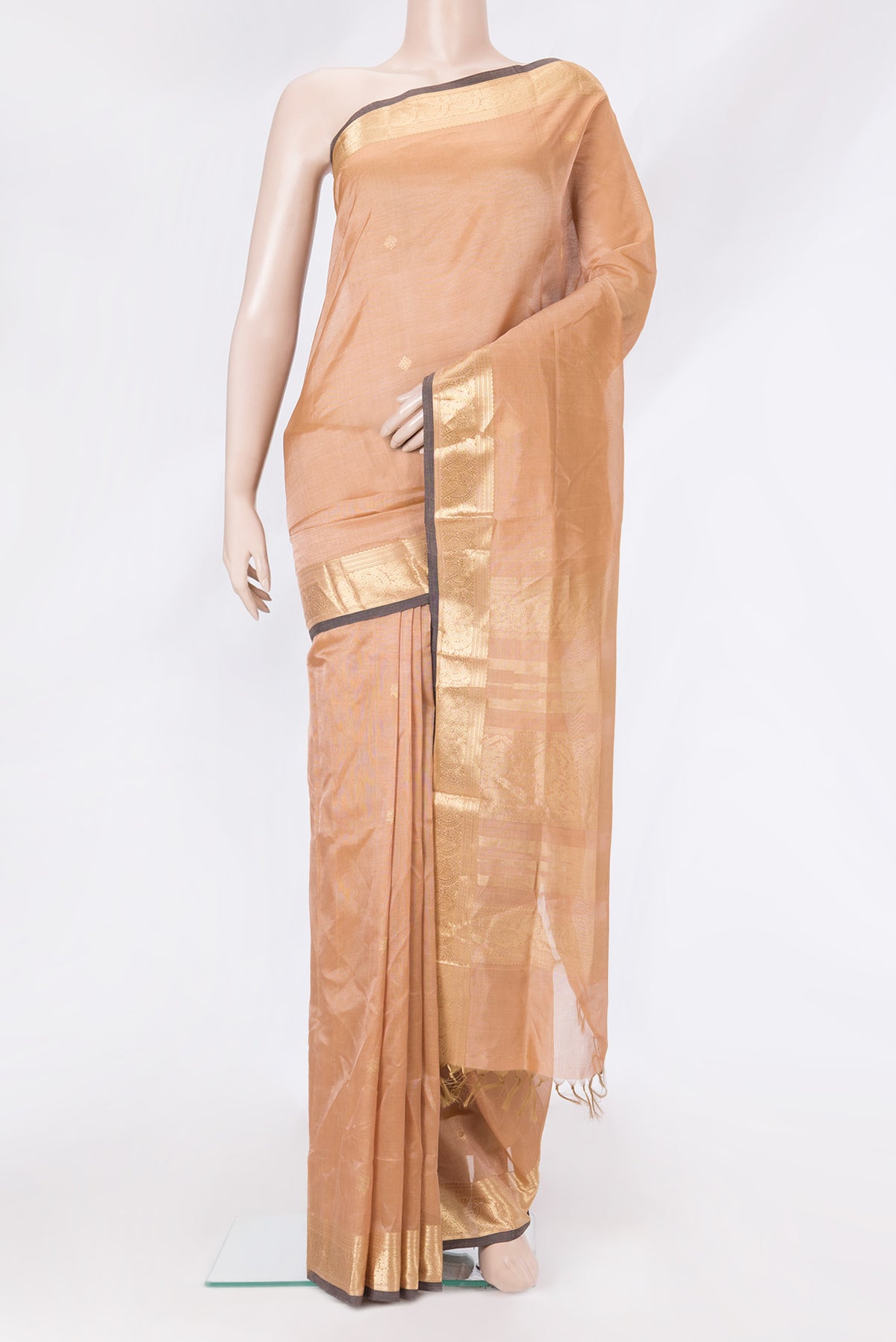 Peach Dual Tone Silk Cotton Saree with Zari Butta on the body and Zari Border.  displayed on a mannequin
