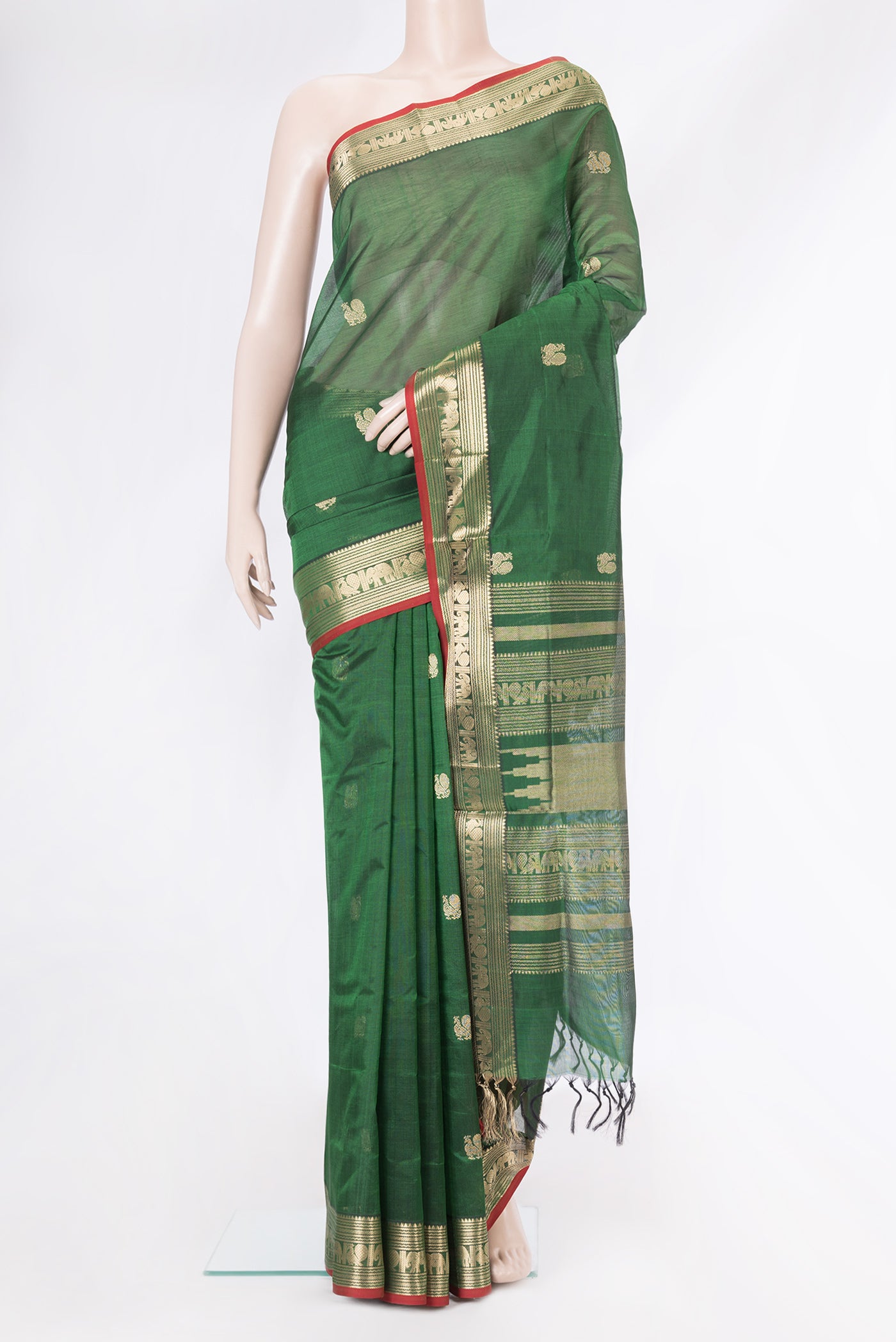 Bottle Green Dual Tone Silk Cotton Saree with Zari Butta on the body and Zari Border.  displayed on a mannequin