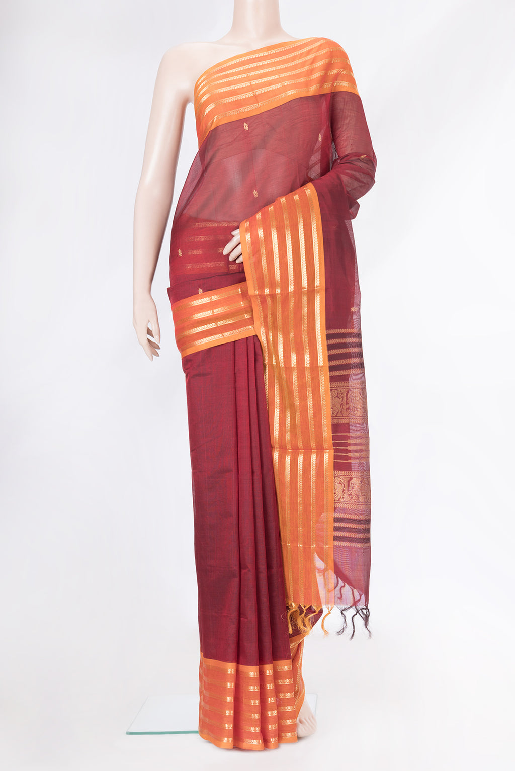 Maroon Dual Tone Silk Cotton Saree with Zari Butta on the body and Zari Border.  displayed on a mannequin