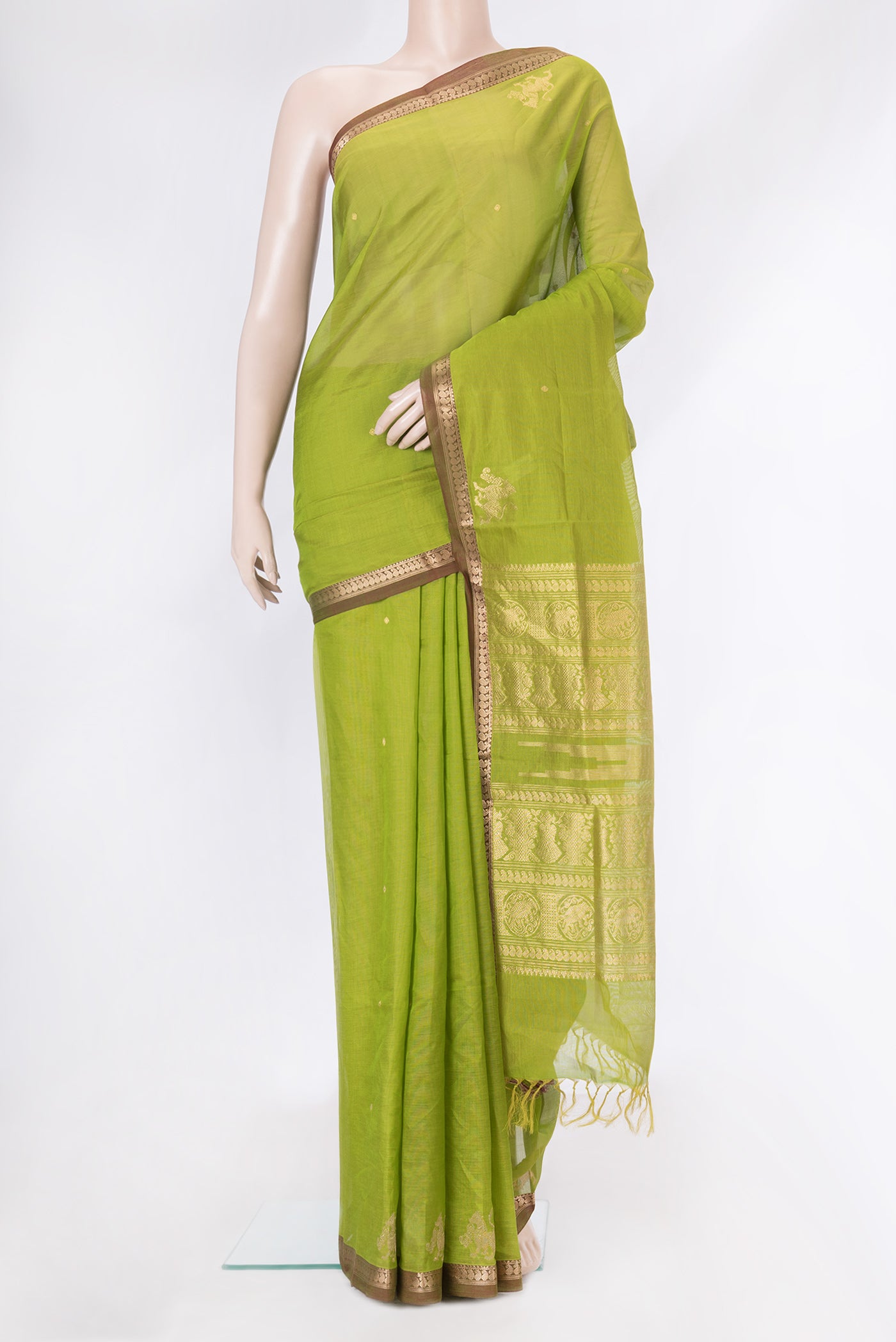 Parrot Green Dual Tone Silk Cotton Saree with Zari Butta on the body and Zari Border.  displayed on a mannequin