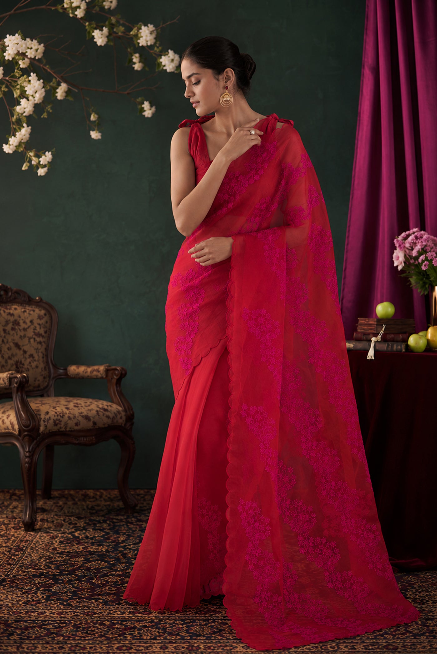 Model wearing a Bella Red floral design saree from Embroidered Romance Collection by Nalli