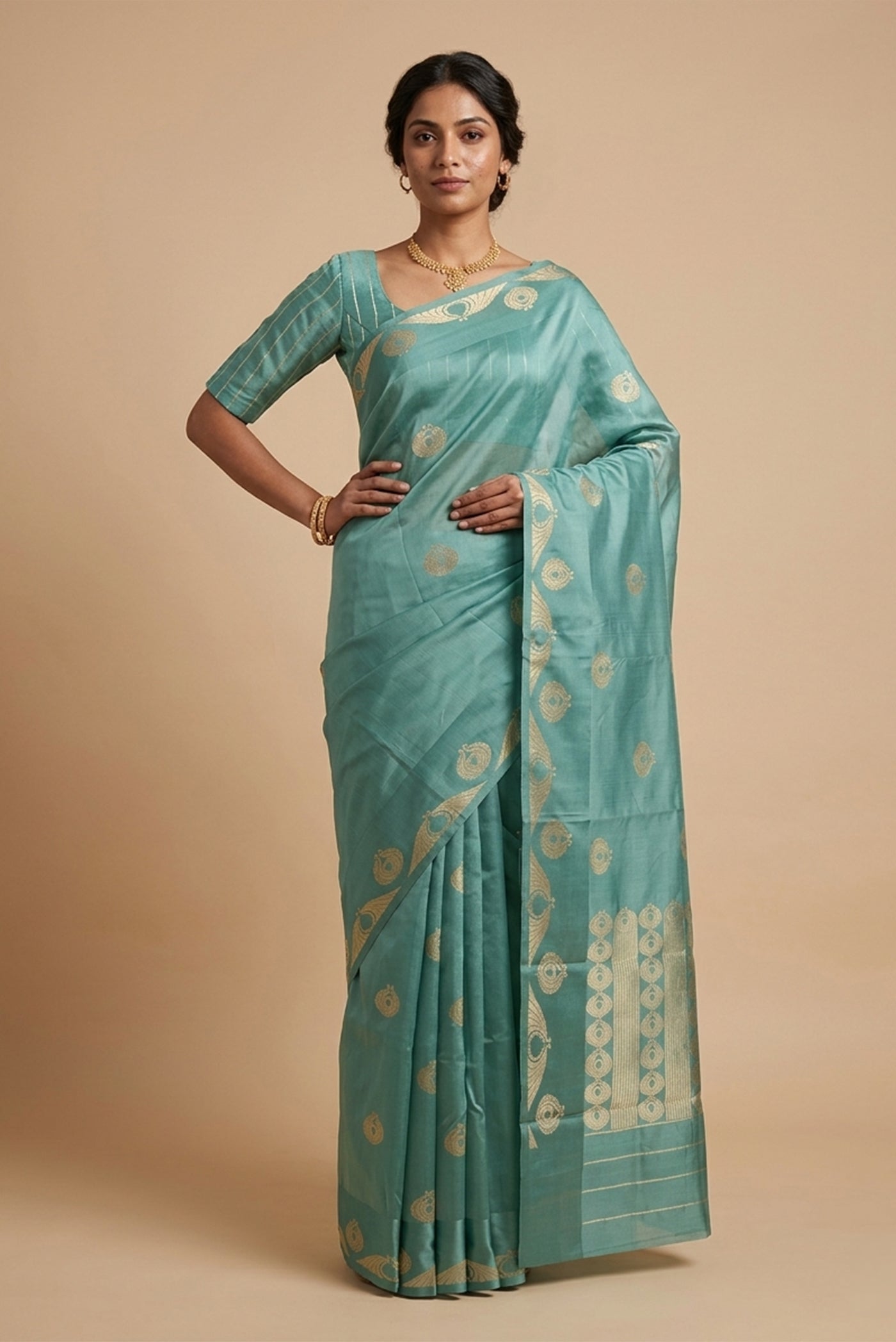 Model wearing a Pakheeru saree from the Sona Chandi Collection draws from Art Nouveau ornamentation and Corinthian sculptural detail. Handwoven in pure Banarasi silk using the Kadhua technique, the body features open-wing motifs framed by olive wreaths and half-step butas, paired with a fluid satin border. A pallu woven with twill lines and wreath motifs in radiant gold zari completes the composition.