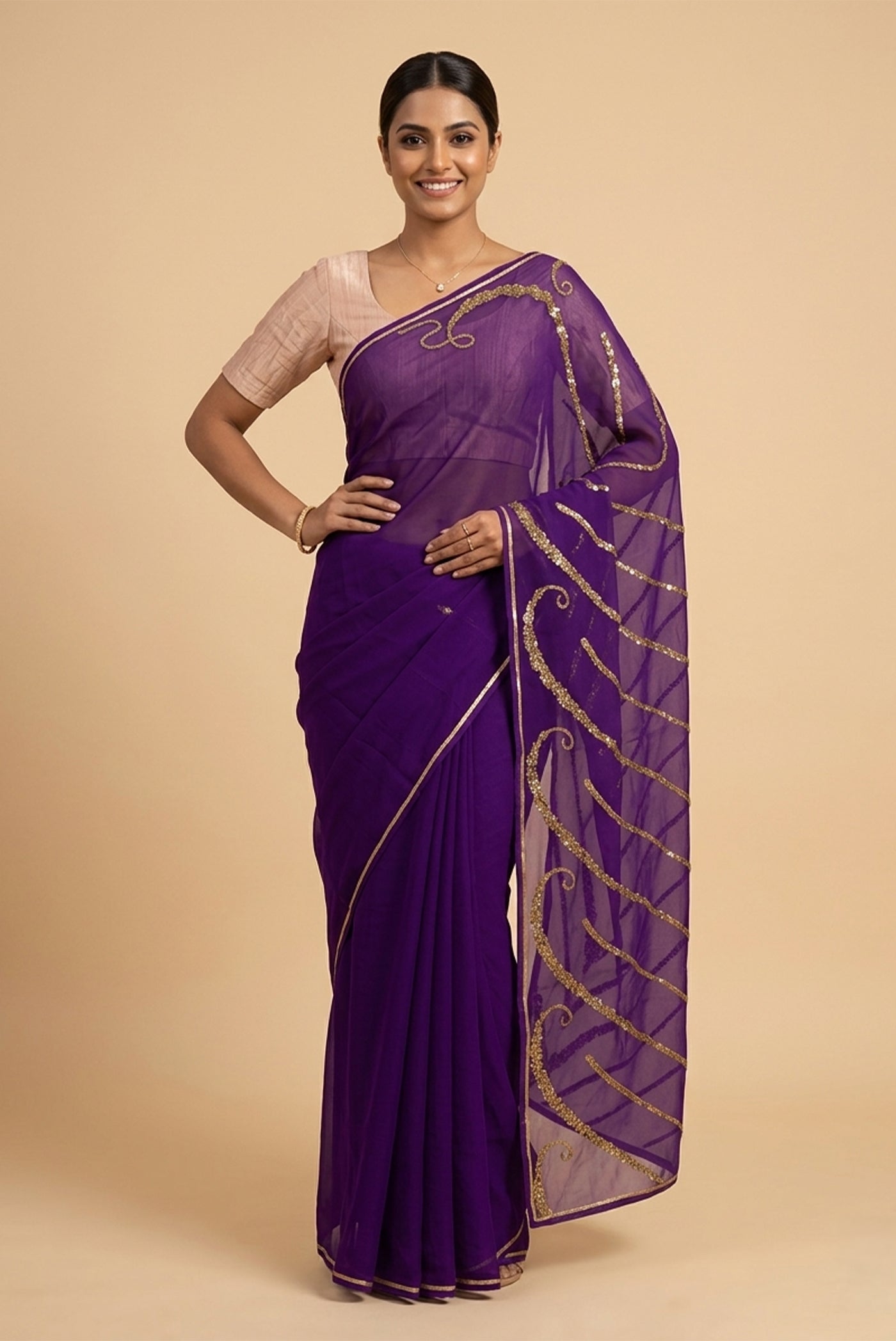 Model wearing a Sitara, crafted in silk organza and embroidered in antique-gold zardozi, draws from Art Nouveau?s love for organic, nature-led forms and the graceful contours of butterfly wings. The pallu features striking V-shaped motifs filled with floral embroidery, worked in dabka, sequins, and beads, alternating between dense and lighter forms. A minimal floral body allows the statement pallu to unfold with soft grandeur.