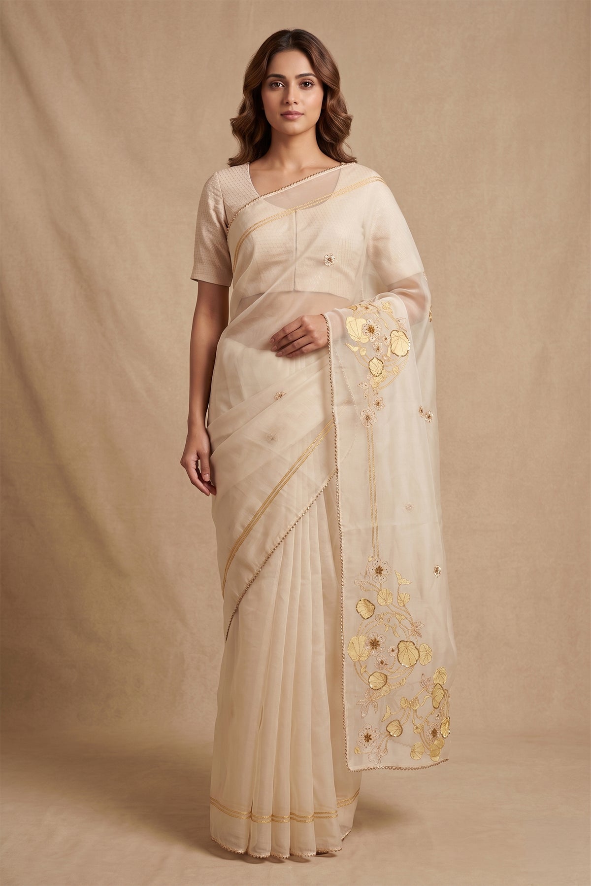 Model wearing a Aboli-Cream Organza Silk Saree