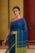 Model wearing a Blue Cotton Saree with Plain Body and Plain Border.