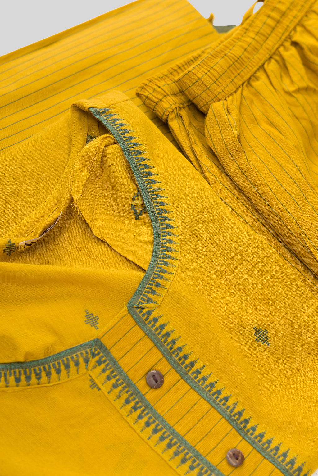 Detailed shot of Mustard Pure Cotton Womens Kurta set featuring Thread Butta Kurta paired with Mustard Stripes bottom and a Thread Butta dupatta in Mustard