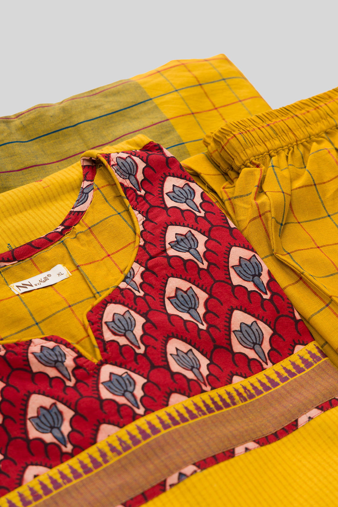 Detailed shot of Mehandi Green Pure Cotton Womens Kurta set featuring Thread Butta Kurta paired with Mehandi Green Checks bottom and a Checks dupatta in Mehandi Green
