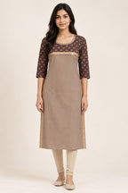 This Beige Cotton Kurta is crafted using Plain Woven detailing, featuring Plain Body design across the silhouette with Round neck front image displayed on an AI model