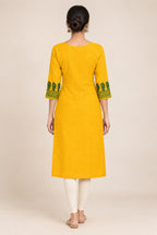 This Yellow Cotton Kurta is crafted using Plain Woven detailing, featuring Plain Body design across the silhouette with Round neck back image displayed on an AI model