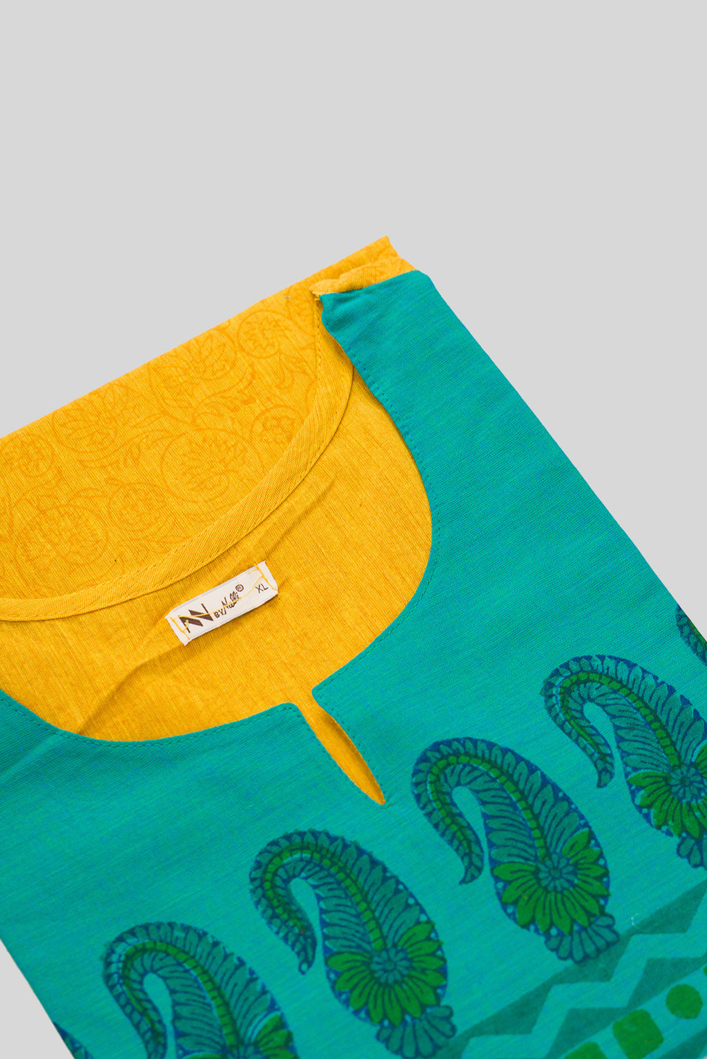 Detailed shot of This Yellow Cotton Kurta is crafted using Plain Woven detailing, featuring Plain Body design across the silhouette with Round neck