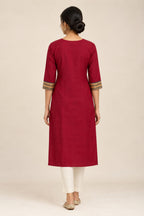 This Maroon Cotton Kurta is crafted using Plain Woven detailing, featuring Plain Body design across the silhouette with U-neck back image displayed on an AI model