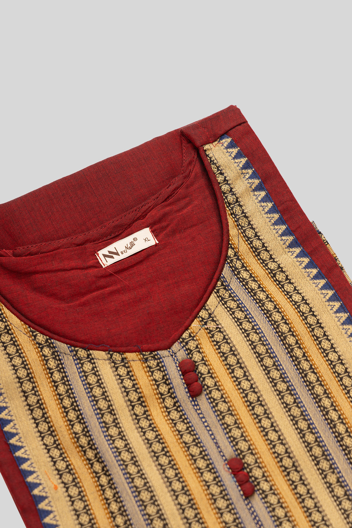 Detailed shot of This Maroon Cotton Kurta is crafted using Plain Woven detailing, featuring Plain Body design across the silhouette with U-neck