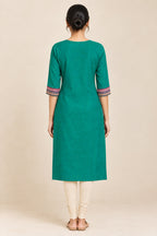 This Sea Green Cotton Kurta is crafted using Plain Woven detailing, featuring Plain Body design across the silhouette with U-neck back image displayed on an AI model
