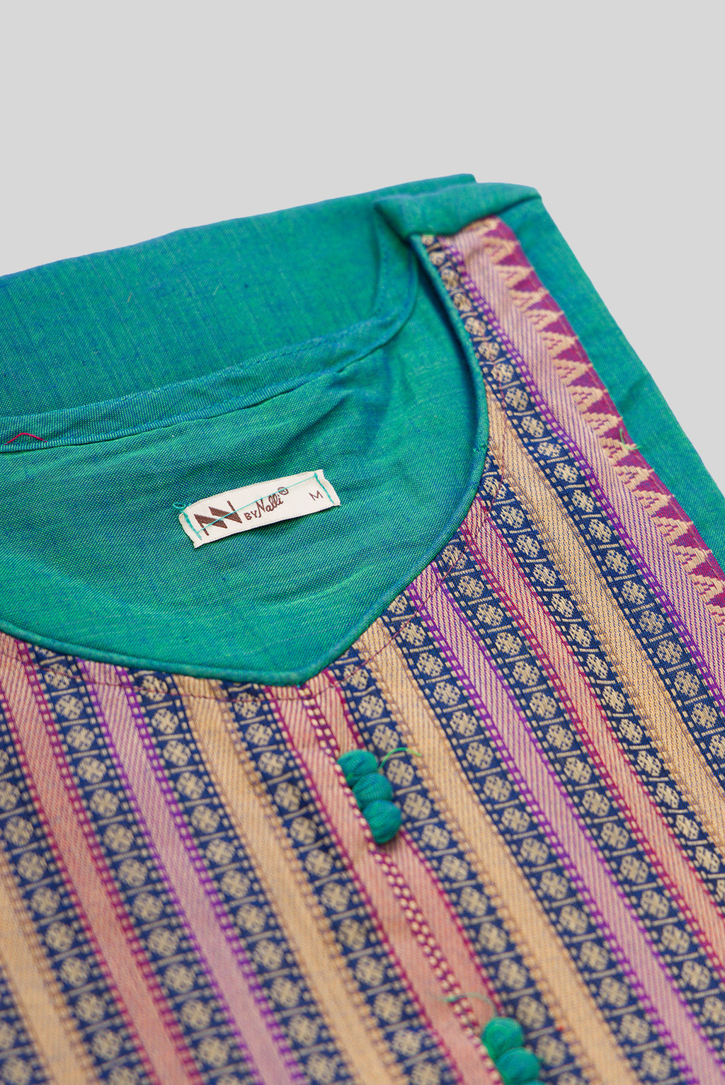 Detailed shot of This Sea Green Cotton Kurta is crafted using Plain Woven detailing, featuring Plain Body design across the silhouette with U-neck