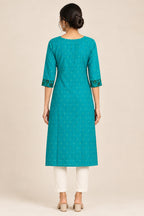 This Turquoise Cotton Kurta is crafted using Woven Design detailing, featuring Thread Butta design across the silhouette with Keyhole neck back image displayed on an AI model