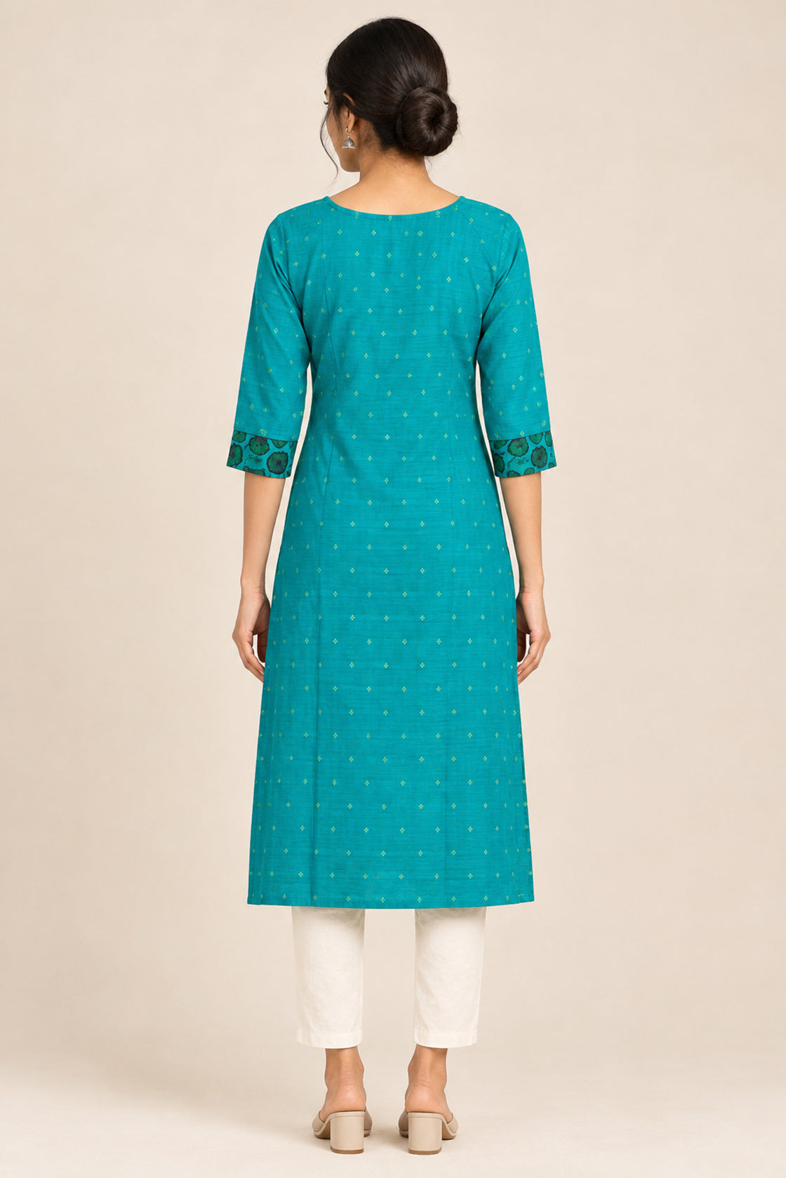 This Turquoise Cotton Kurta is crafted using Woven Design detailing, featuring Thread Butta design across the silhouette with Keyhole neck back image displayed on an AI model