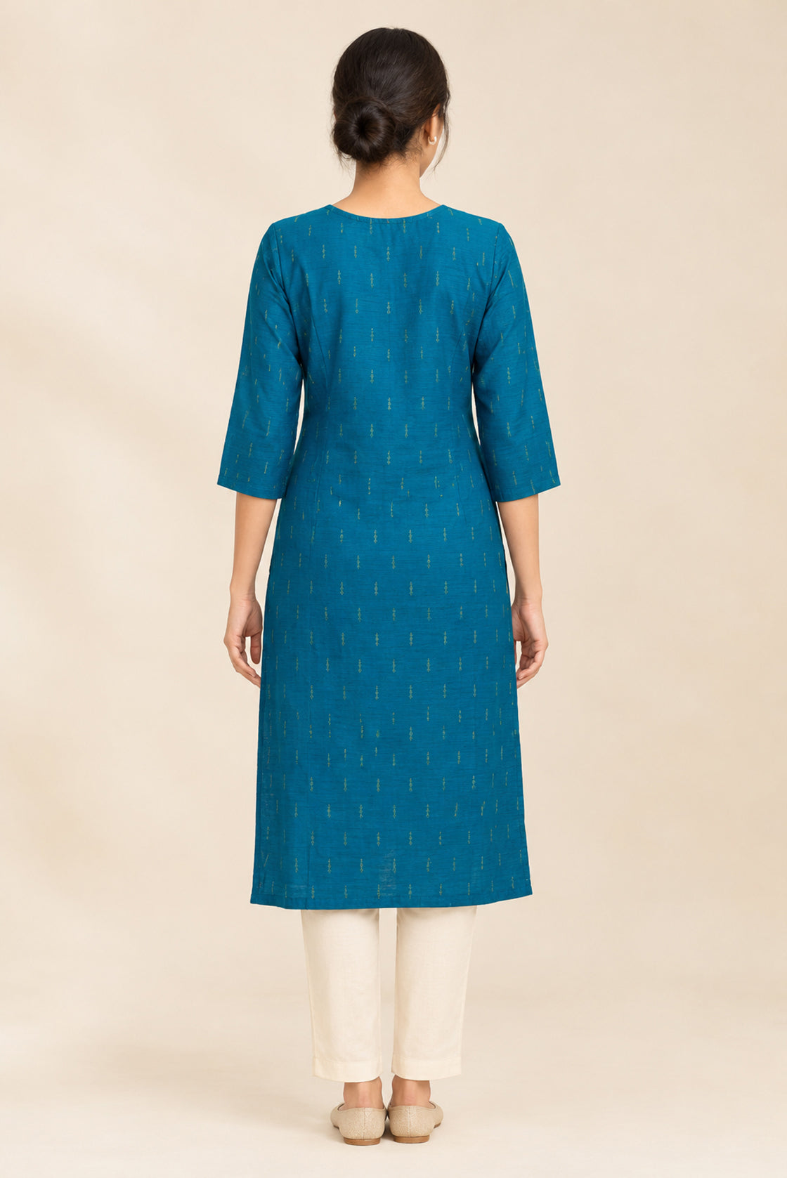 This Peacock Blue Cotton Kurta is crafted using Woven Design detailing, featuring Thread Butta design across the silhouette with Round neck back image displayed on an AI model