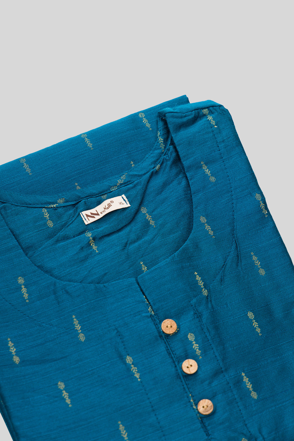 Detailed shot of This Peacock Blue Cotton Kurta is crafted using Woven Design detailing, featuring Thread Butta design across the silhouette with Round neck
