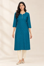 This Peacock Blue Cotton Kurta is crafted using Woven Design detailing, featuring Thread Butta design across the silhouette with Round neck front image displayed on an AI model