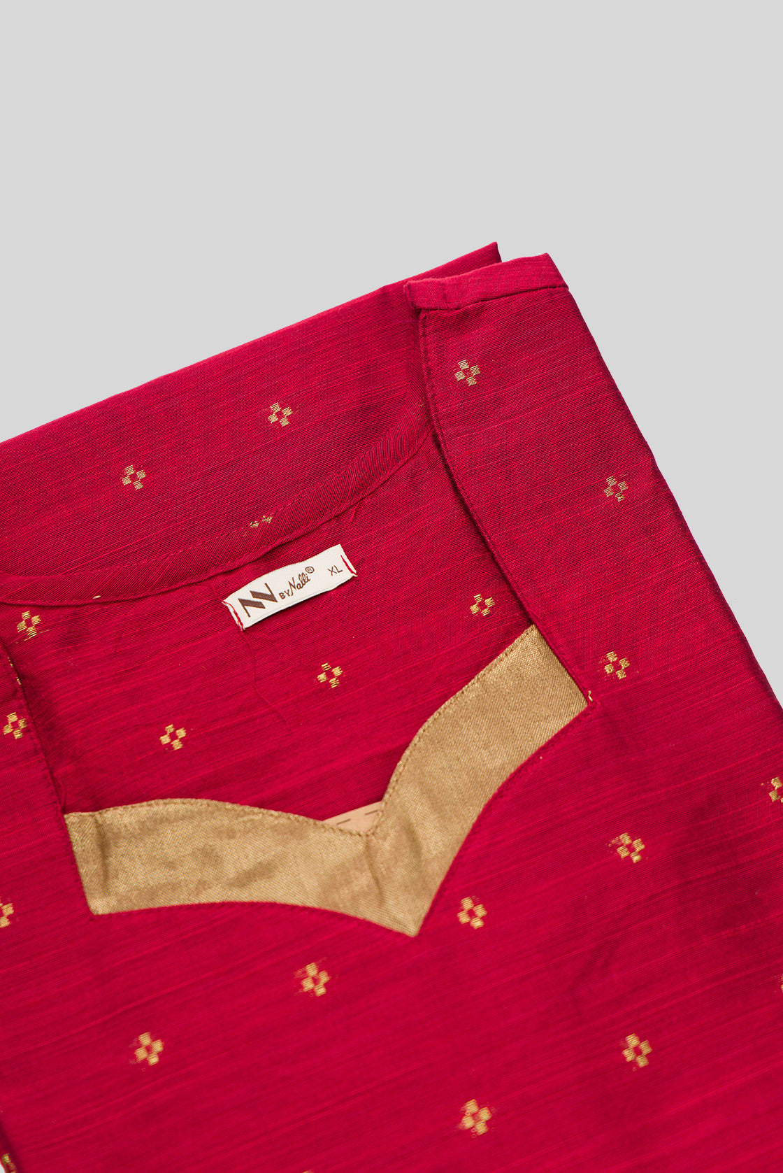 Detailed shot of This Red Cotton Kurta is crafted using Woven Design detailing, featuring Thread Butta design across the silhouette with V-neck